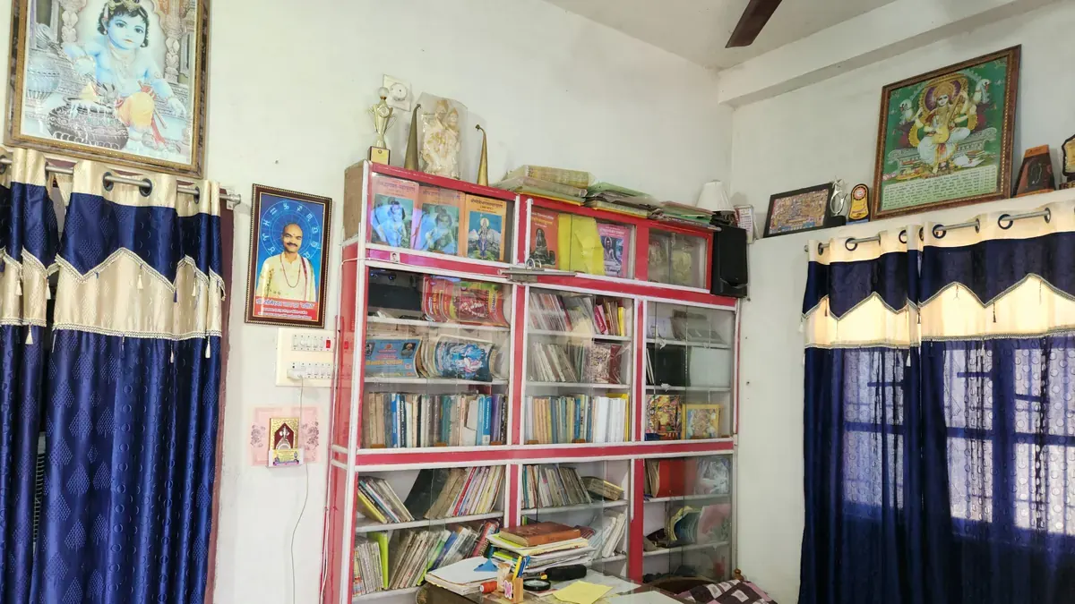 Dr. Dadhichy office with astrology books and trophies